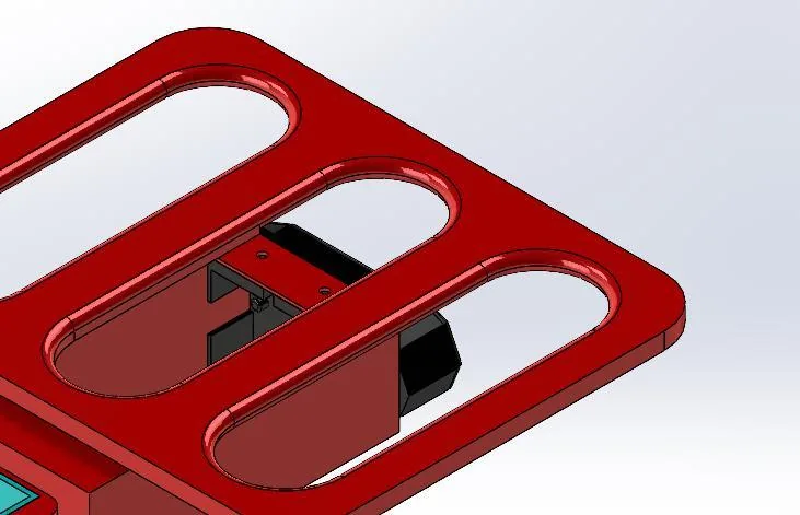 Rendu 3D du top-case&nbsp;: platine ajourée en acier avec support arrière.